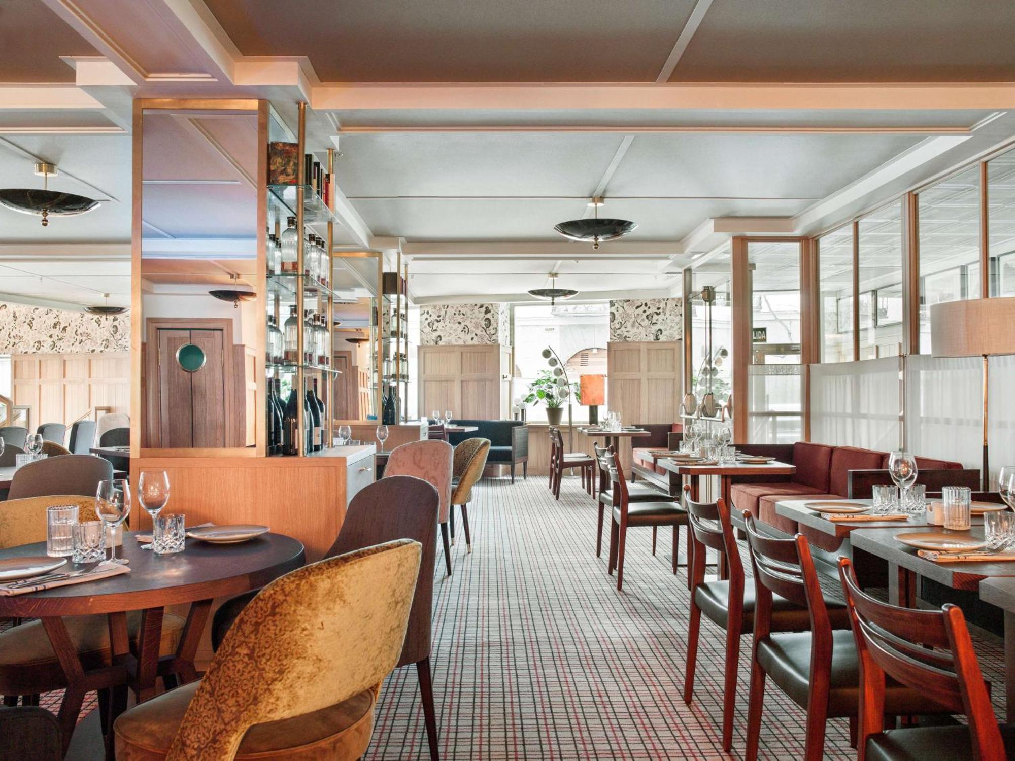 فندق إن إتش كوليكشن مدريد سيوسيا المظهر الخارجي الصورة The interior of the restaurant
